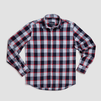 A long-sleeve button-up shirt with a large plaid pattern in navy blue, white, gray, and red, laid flat on a white background.