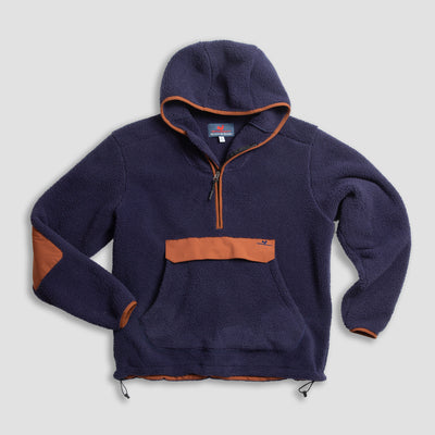 A navy blue hooded fleece pullover with a front pocket, half-zip closure, and orange accents on the pocket, cuffs, and inner hood, laid flat on a light background.
