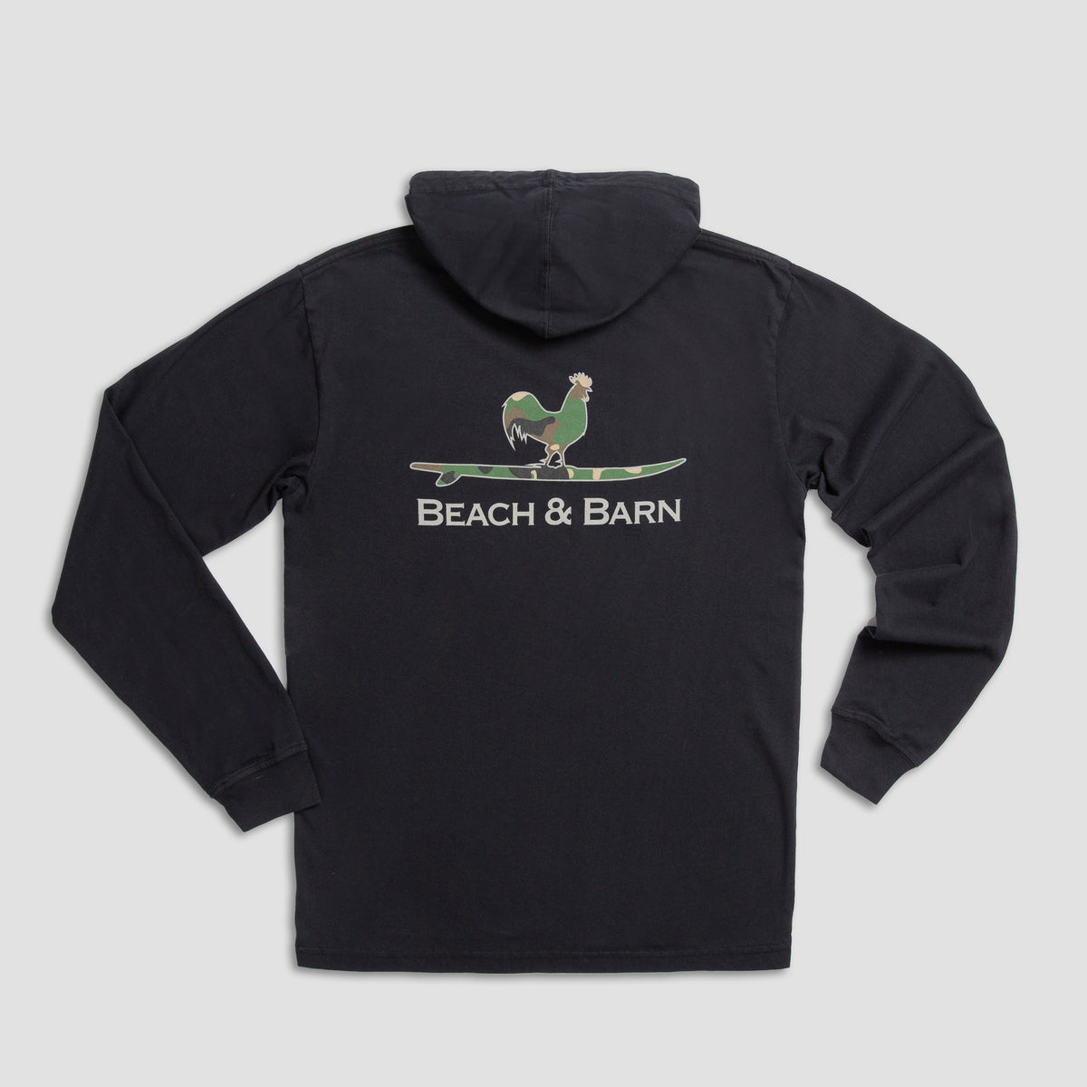 A black hooded sweatshirt with a graphic of a green chicken standing on a surfboard above the words BEACH & BARN on the back.