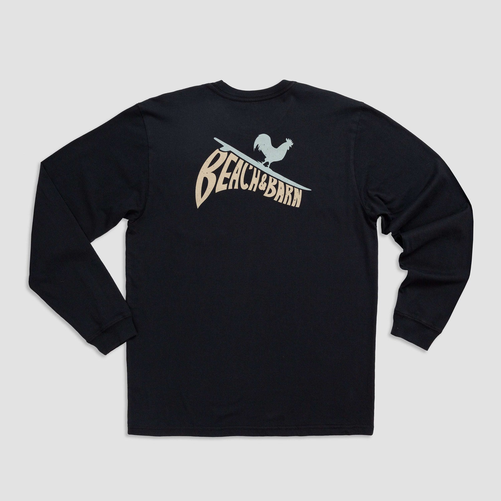 A black long-sleeve shirt with a graphic on the back showing a rooster standing on a surfboard above the stylized text BEACH BARN.